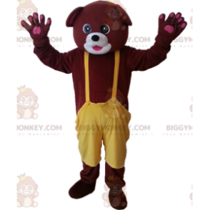 Brown Bear BIGGYMONKEY™ maskottiasu keltaisilla haalareilla -