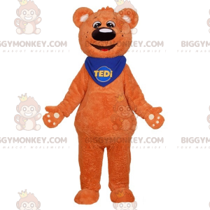 Měkký a roztomilý kostým maskota oranžového medvídka