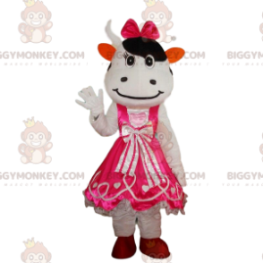 Disguise of white and black cow dressed in a pink dress –