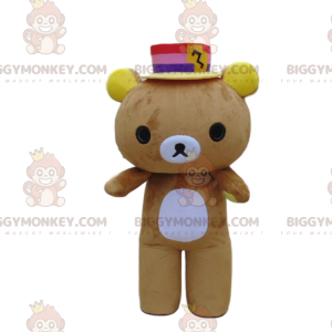 Brown and white teddy bear costume with a colorful hat -