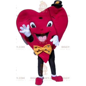 Heart BIGGYMONKEY™ maskottiasu, jossa pieni hattu ja rusetti -