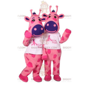 Mascote BIGGYMONKEY™ de duas girafas cor de rosa com manchas