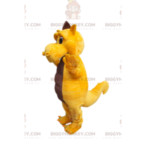 Celý kostým smutně žlutého a hnědého dinosaura s maskotem
