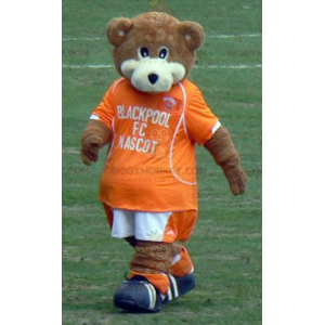 Ruskeavalkoinen Teddy BIGGYMONKEY™ maskottiasu oranssilla