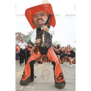 Cowboy BIGGYMONKEY™ maskotdräkt i orange och svart traditionell