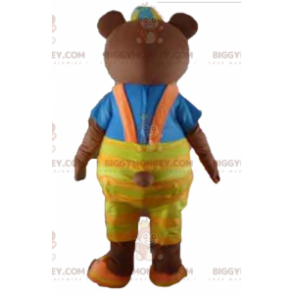 Brown bear BIGGYMONKEY™ mascot costume with yellow overalls and