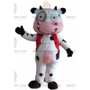 Erittäin hymyilevä valkoinen musta ja vaaleanpunainen lehmän
