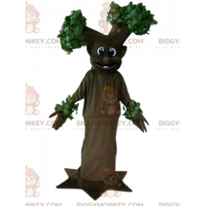 Costume da mascotte gigante sorridente marrone e albero verde