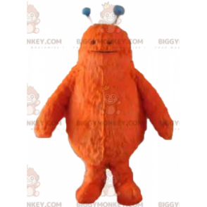 Bonito disfraz de mascota monstruo naranja peludo BIGGYMONKEY™