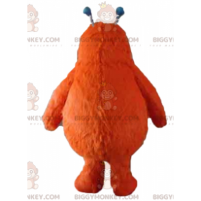 Bonito disfraz de mascota monstruo naranja peludo BIGGYMONKEY™