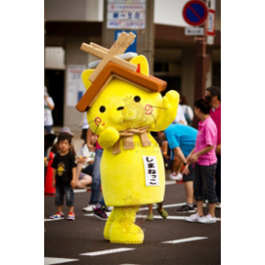 BIGGYMONKEY™ maskottiasu keltainen kissa talon katolla päässä -