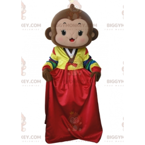 Ruskea apina BIGGYMONKEY™ maskottiasu värikkäällä mekolla -