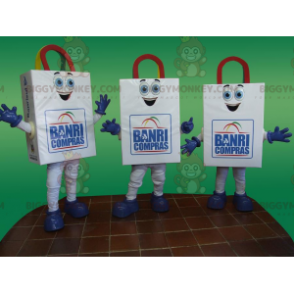 3 uśmiechnięte maskotki BIGGYMONKEY™ z białą papierową torbą -