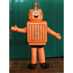 Χαριτωμένο χαμογελαστό πορτοκαλί και μαύρο ρομπότ στολή μασκότ