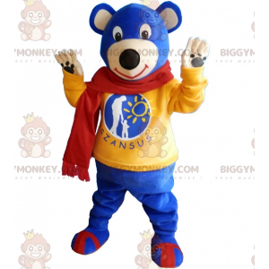 Μπλε στολή μασκότ Teddy BIGGYMONKEY™ με κίτρινο πουλόβερ και